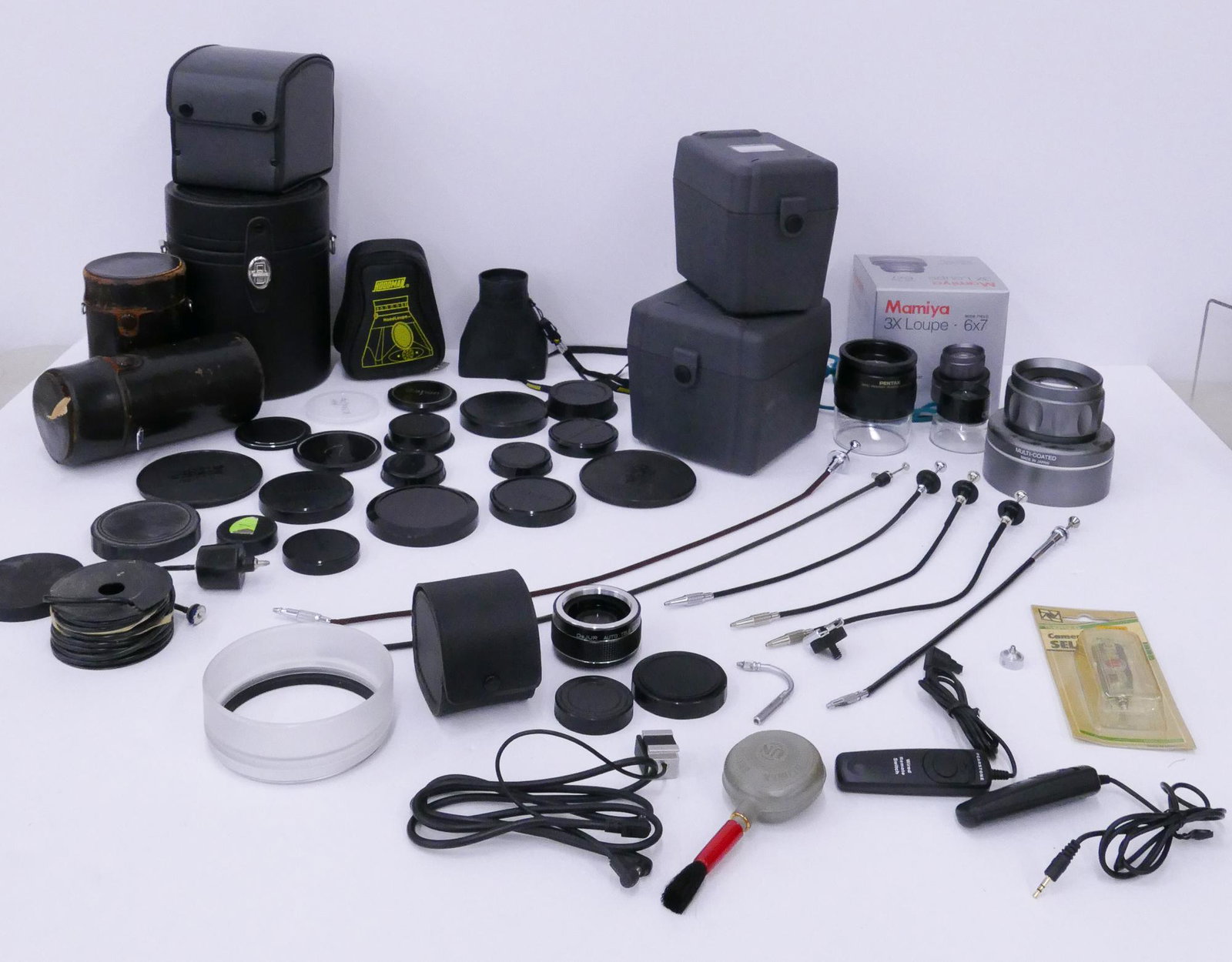Group Camera Accessories: Group Camera Accessories. Includes Lens Storage Cases (Fuji, Nikon, Topcon), Loupes (Pentax 5.5x, Mamiya 3X, Hoodman HoodLoupe), DeJUR 2X Converter, Shutter Release Cables, Remote Shutter Switches, Le