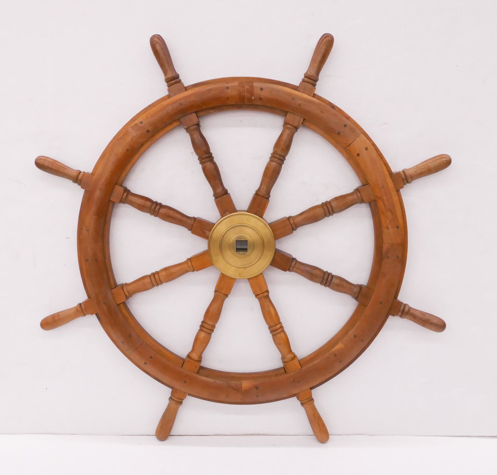 Wood and Brass Ship's Wheel: Wood and Brass Ship's Wheel. Measures 43" in diameter with 6.5" diameter brass hub with 1x1" spindle drive square.