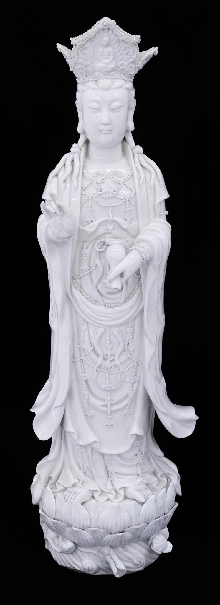 Chinese Blanc de Chine Standing Guanyin: Chinese Blanc de Chine Porcelain Standing Guanyin 25.5''x8''. Intricately decorated crowned standing guanyin on lotus thrown. Unmarked. Professional repair to upper crown and slight chip to lotus flow