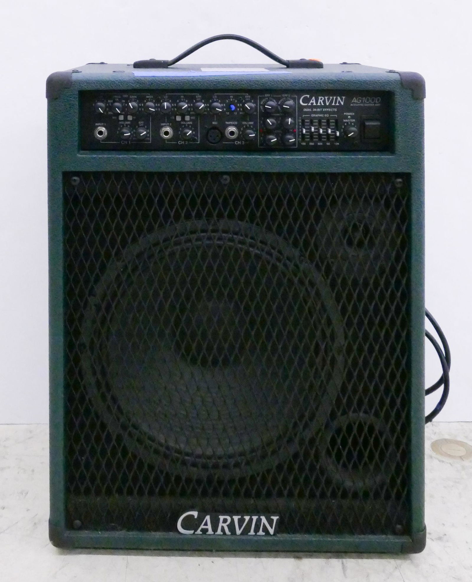 Carvin Model AG100D Acoustic Guitar Amp: Carvin Model AG100D Acoustic Guitar Amp. 12'' speaker, 3'' tweeter. Green tolex. Condition- very good with one minor tear in tolex.