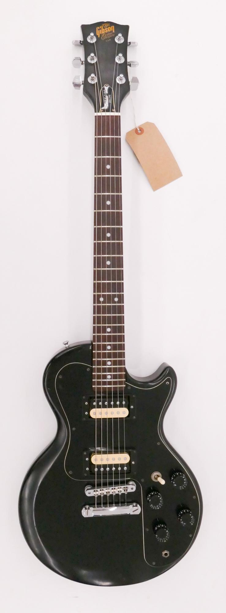 Gibson Sonex-180 Deluxe Electric Guitar, 1980: Gibson Sonex-180 Deluxe Electric Guitar, 1980. Serial #83500741. Comes with hardshell case. Fiber body, rosewood fingerboard, all original components. Condition- overall good with lots of play wear.
