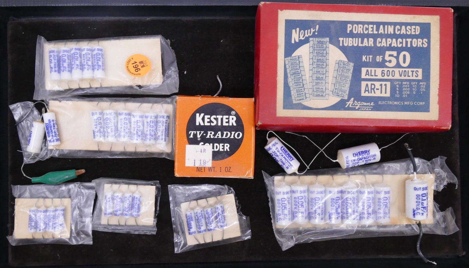 Group Vintage Argome Tubular Capacitors: Group Vintage Argome Cherry Porcelain Tubular Capacitors. Made in Japan. 35pc total in various sizes. Comes with vintage original box and Kester TV-Radio Solder. Untested.