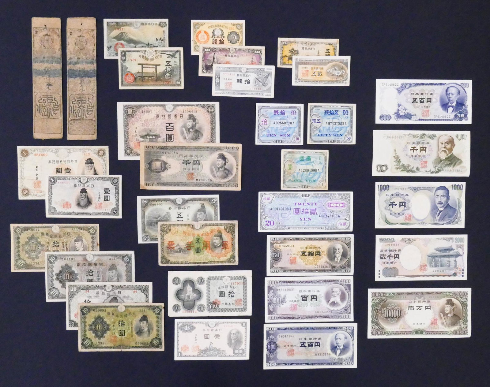 Japan. 33pc mid-1800's-2000: Japan. 33pc mid-1800's-2000. Includes 2pc Amagasaki Han Silver Momne Hansatsu Bookmark Scrip Notes, 4pc Series 100 Military Currency