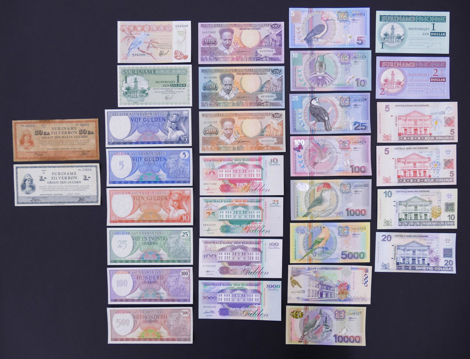 Suriname. 31pc 1941-2012: Suriname. 31pc 1941-2012. Includes Zilverbon 50 Cent 30.4.1942 Pick 104 and 1 Gulden 1.6.1941 Pick 105. All but the 2pc mentioned are UNC.