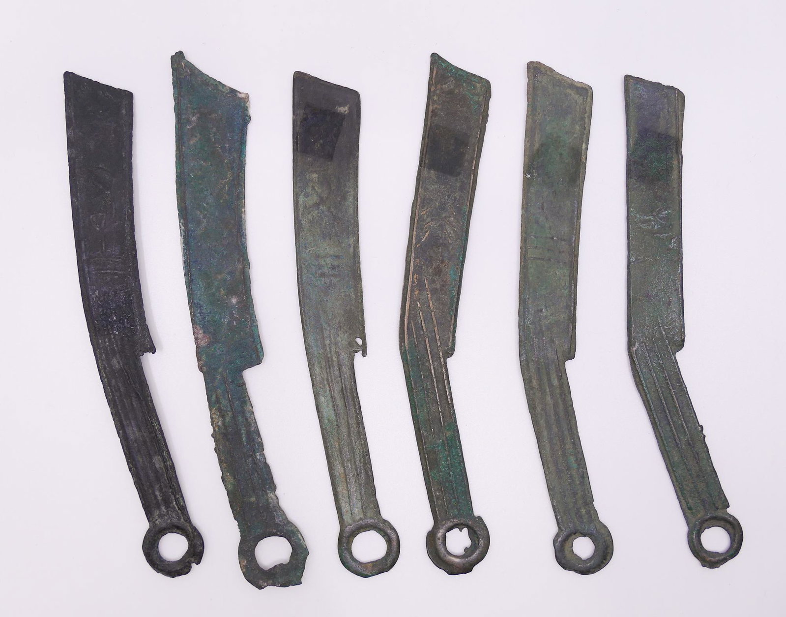 China. 6pc Warring States Knife Money: China. 6pc Warring States Knife Money (400-220 BC). State of Yan. Knife coins measure between 5 1/4'' and 5 3/4'' long, 3/4'' (18mm) at widest, and roughly 1/8'' and up to (2mm) thick at widest point.
