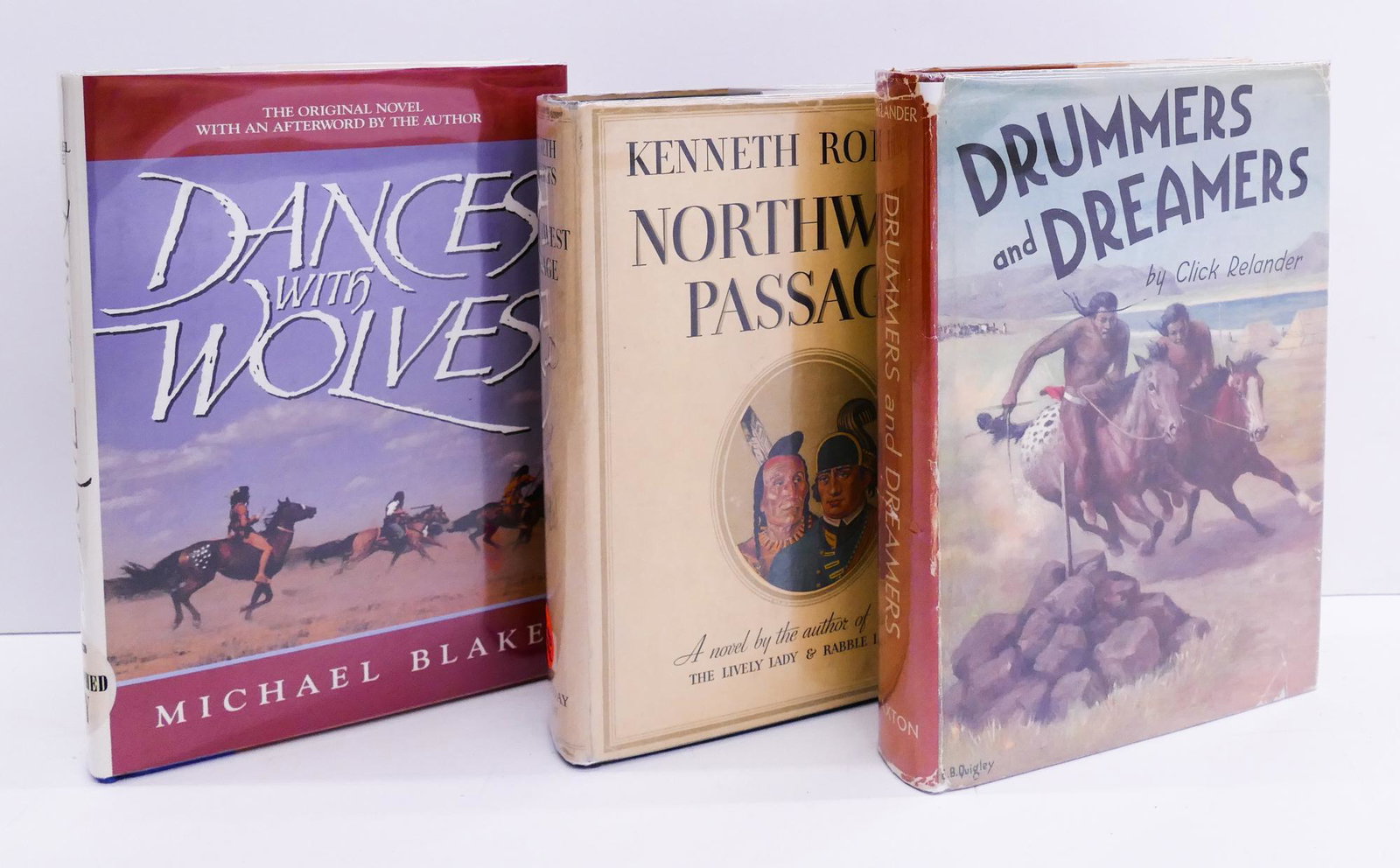 3pc Author Signed Books. Dances with Wolves Etc: 3pc Author Signed Books. Includes Michael Blake 'Dances with Wolves' Newmarket Press First Hardcover Edition 1991, Kenneth Roberts 'Northwest Passage' Doubleday Doran & Company 1937, and Click Relande