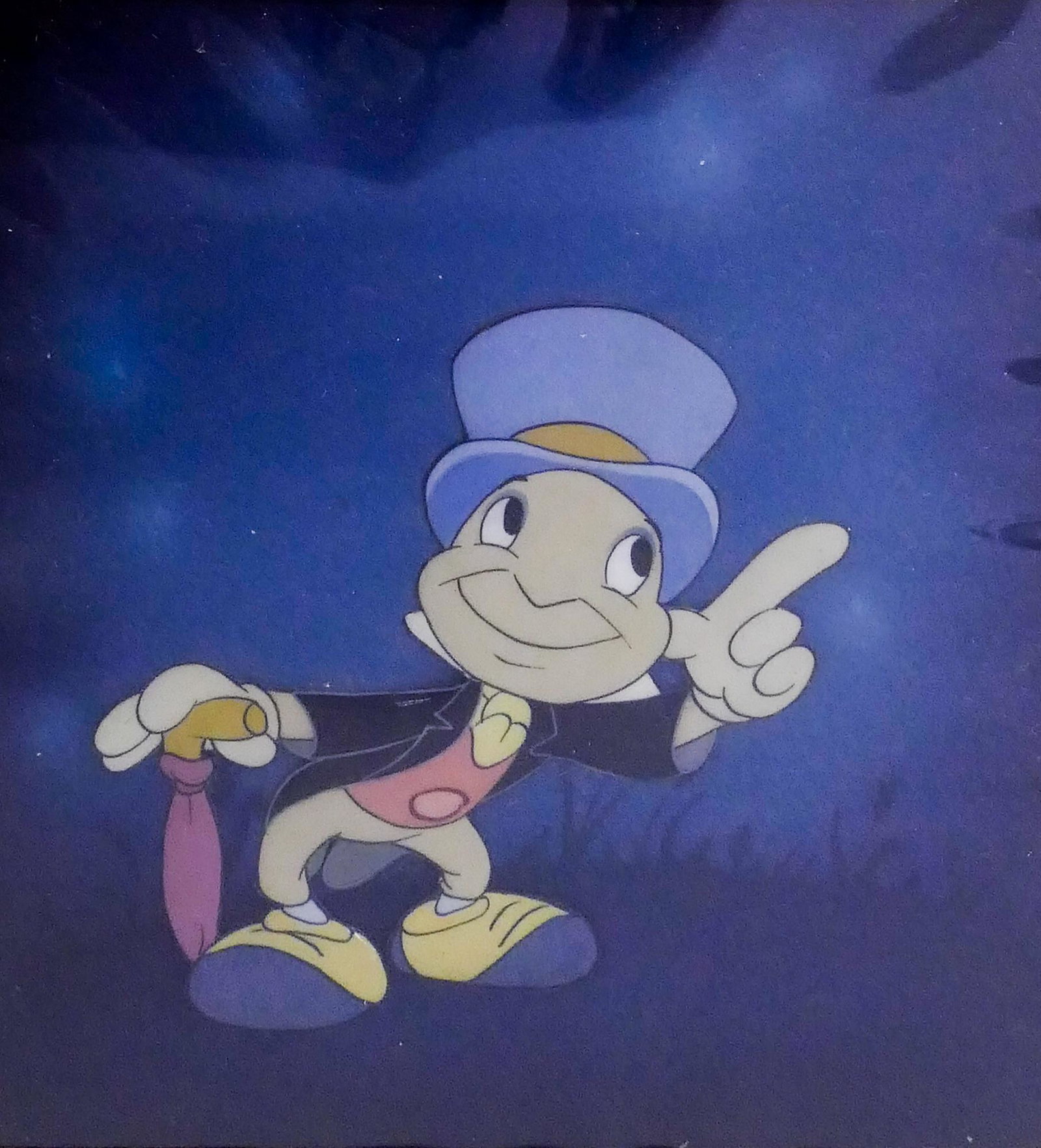 Disney Jiminy Cricket Pinocchio Original Cel, 1939: Disney Jiminy Cricket Pinocchio Original Painted Cel. 1939. Framed 10.75x10.5'' with cel measuring 4.5x4.25''. Sold by Courvoisier Galleries, San Francisco, California.