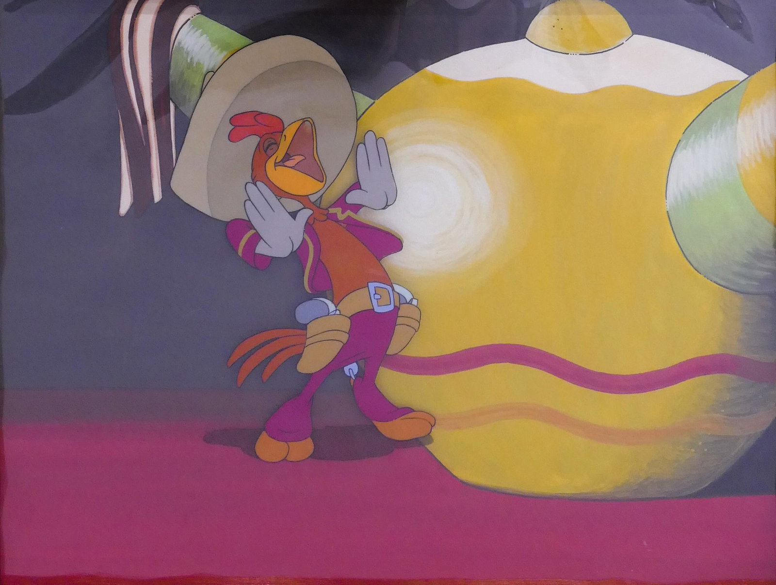 Disney The Three Caballeros Cel, 1945: Disney 'Panchito' The Three Caballeros Original Production Cel, 1945. Handpainted Background. Framed measurements are 17.25x19.5'' with 8.5x11'' window. Great American Ink COA on back with Gallery Dir