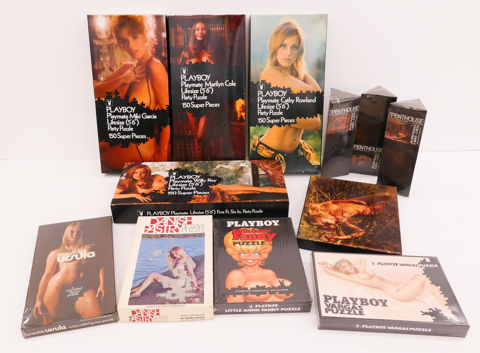 12pc Vintage Playboy, Penthouse & Erotic Puzzles: 12pc Vintage Playboy, Penthouse, and Erotic Puzzles. Includes 4pc Playboy Playmate Lifesize Party Puzzles 1971-1973 (opened and gently used), 3pc 1970's Penthouse 2 Sided Jigsaw Puzzles (New in Packag