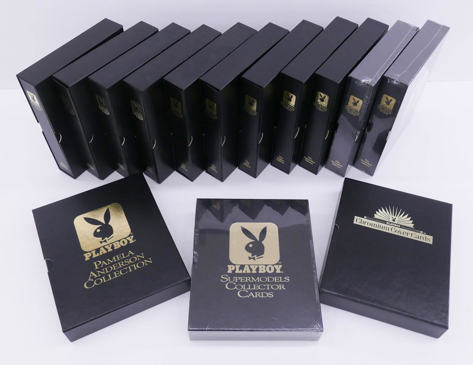 14pc Playboy Trading Card Binders & Cards 1993-97: 14pc Playboy Trading Card Binders & Cards 1993-97. 1988pc Cards Total. Includes 122pc Pamela Anderson with 2 Oversized, 1695pc Playmate Cards including 3pc signed cards (Lisa Sohm, Ellen Michaels, and