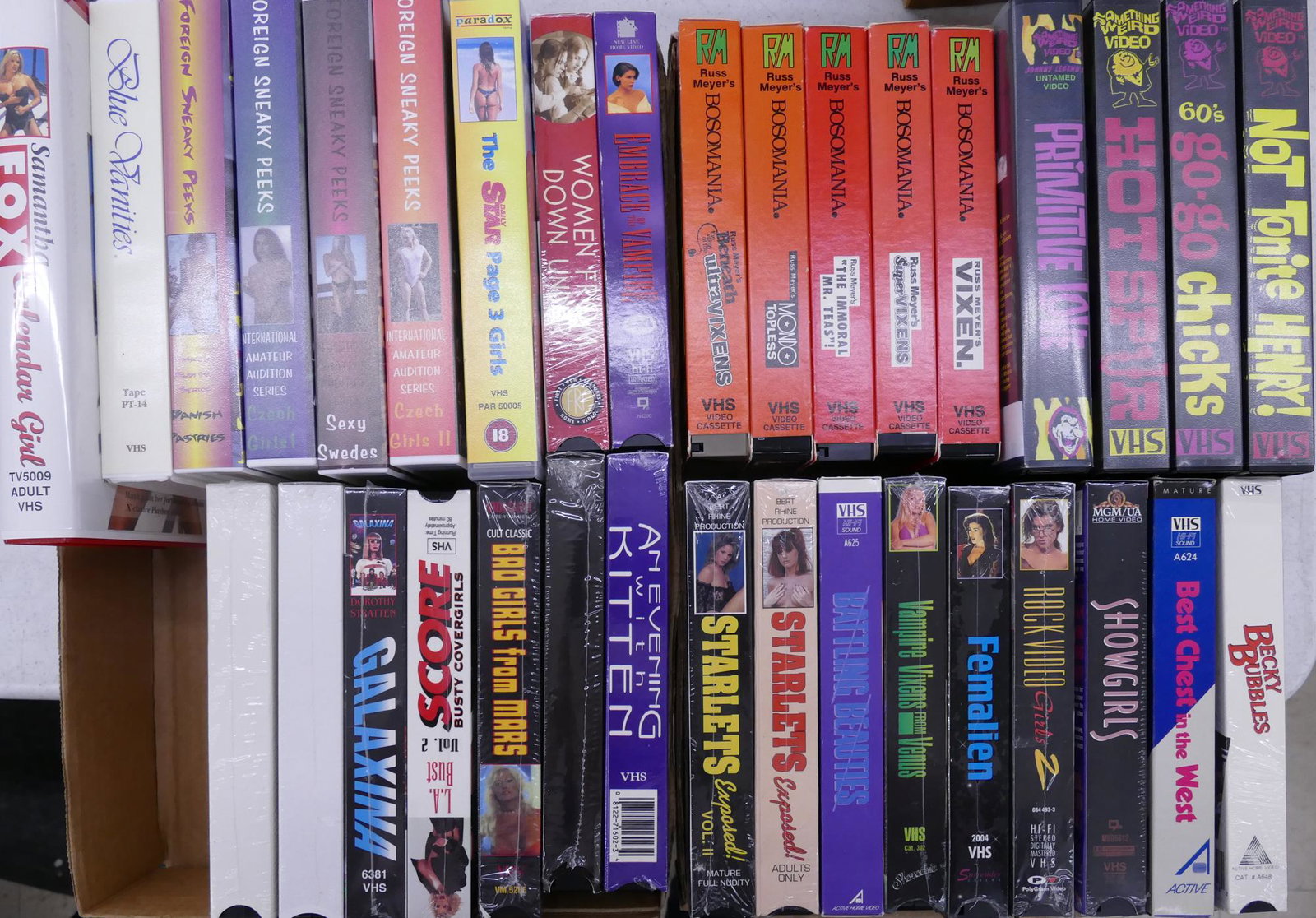 34pc Vintage Erotic VHS Videotapes: 34pc Vintage Erotic VHS Videotapes. Includes titles from Something Weird Video, Russ Meyer's Bosomania, Sneaky Peeks, and an assortment of interesting and amateur videos