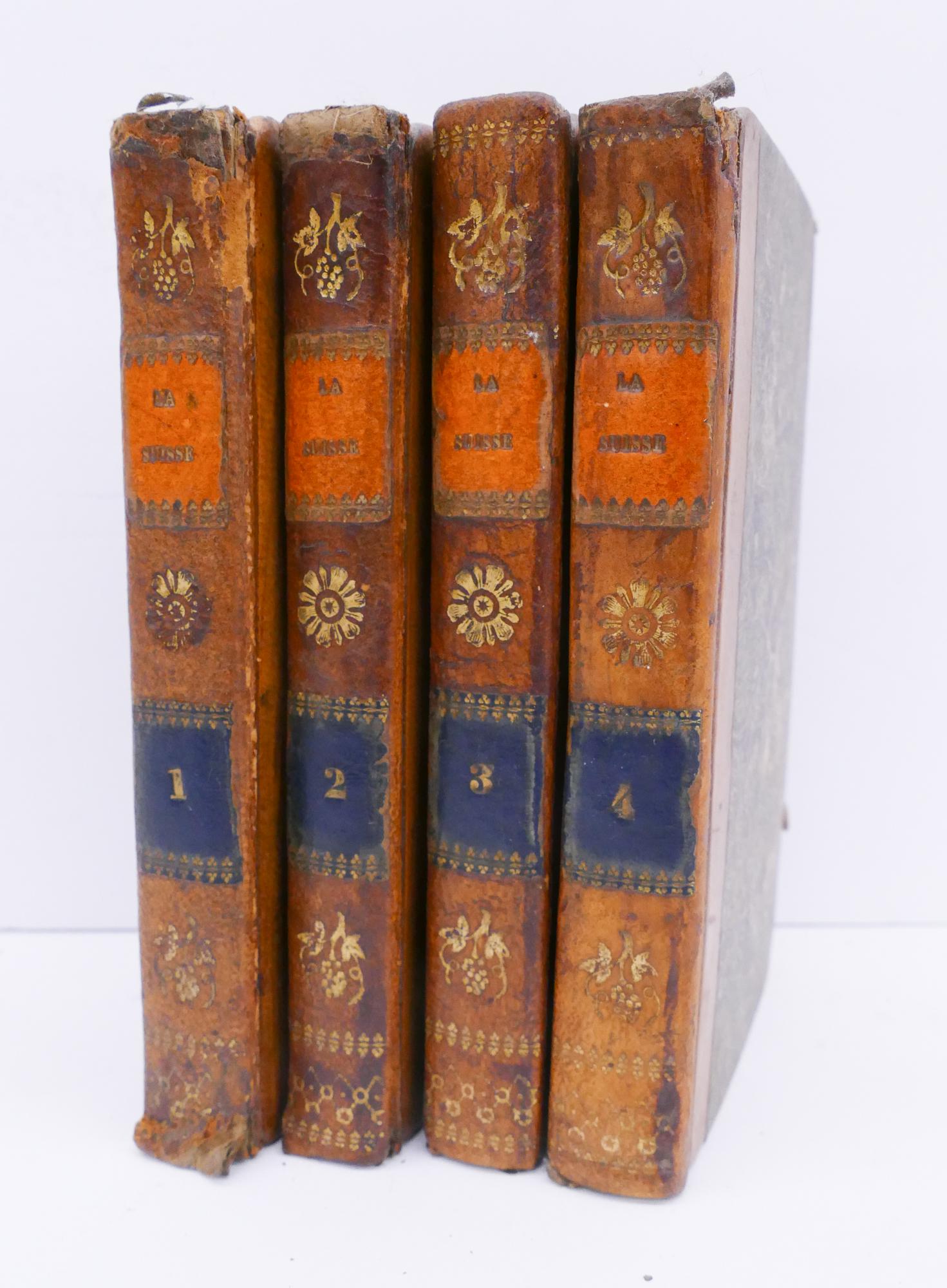 4 Volume 'La Suisse' Second Edition Set, Paris 1824: 4 Volume 'La Suisse' Second Edition Set, Paris 1824. Pocket sized books each measuring 5.75x3.75x.75". French. Fold-out maps & engravings. Marbled covers and end pages, leather bound spine, gilt decor