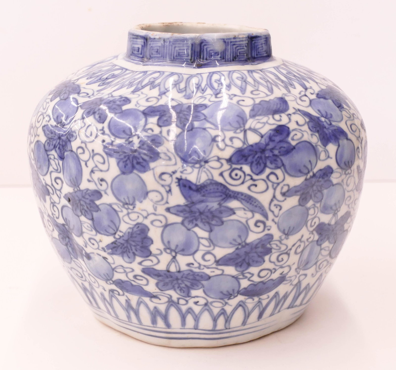 Chinese Ming Blue and White Lobed Jar: Chinese Ming Blue and White Lobed Jar 6.5''x7.5''. Blue underglaze pomegranate and leaf motif with three squirrels. Unmarked, Wanli period. Some scattered slight glaze flaking to top rim. 16th or 17th