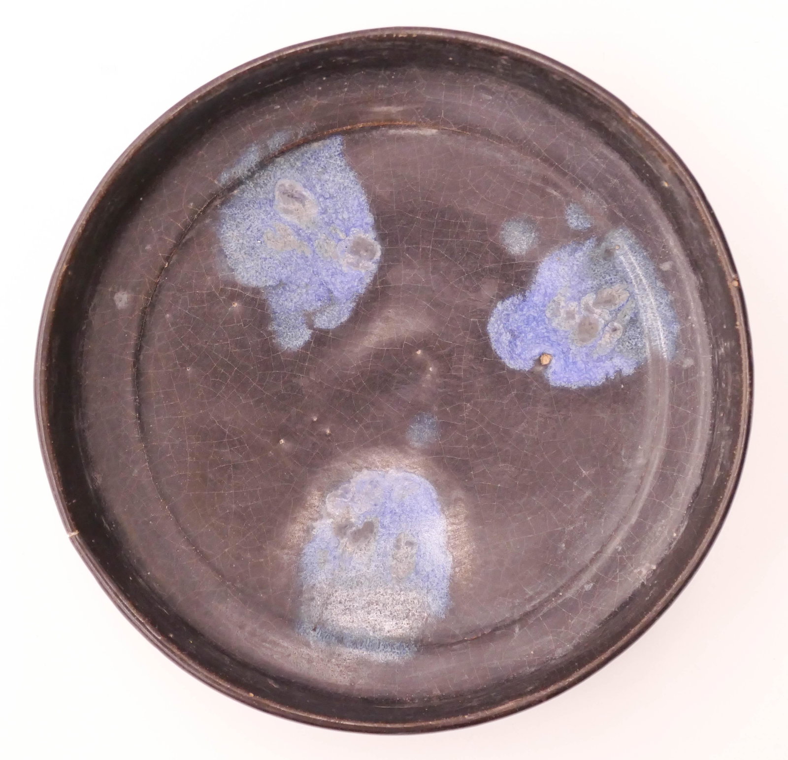 Chinese Tang Phosphatic Splash Black Dish: Chinese Tang Phosphatic Splash Black Dish 9.25''x2''. Scarce deep high walled dish with three blue phosphatic glaze splashes. Exterior has two heavy dripping phosphatic blue glaze splashes as well. Sl