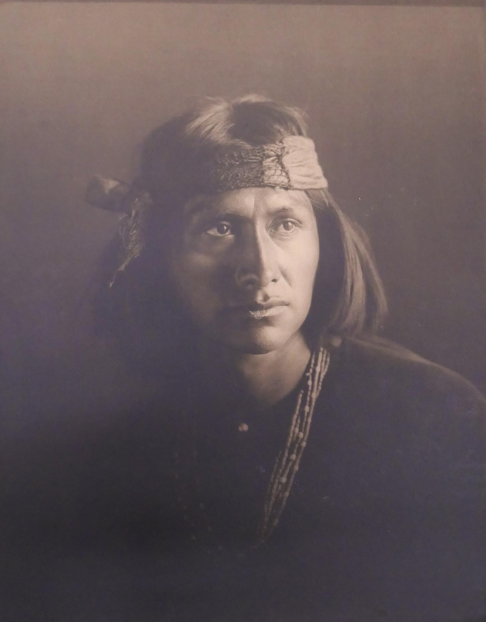 Carl Moon ''The Wolf'' Silver Gelatin Photograph: Carl Moon (1878-1948, California) ''The Wolf'' Silver Gelatin Photograph, 1904. 16''x12.5''. Not signed. Framed in antique oak frame 23.5''x20''. Good condition with 1'' V-shaped tear to mouth area.