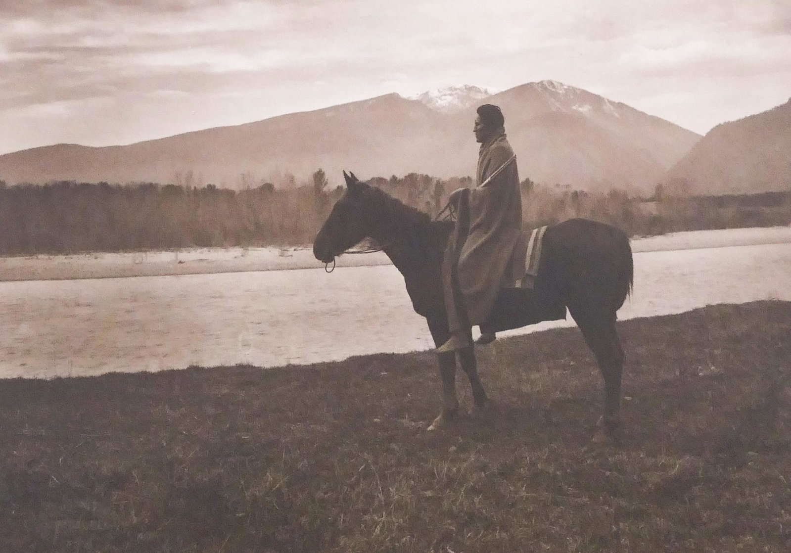 J.G. Showell ''Native on Horseback'' Print: J.G. Showell (19th/20th Century Montana) ''Native on Horseback'' Silver Gelatin Print, 1910. 6''x8'' Sight. Blind stamped 'Copyright 1910 J.G. Showell Bitter Root' at l.l. Framed 12''x13''. Excellent 