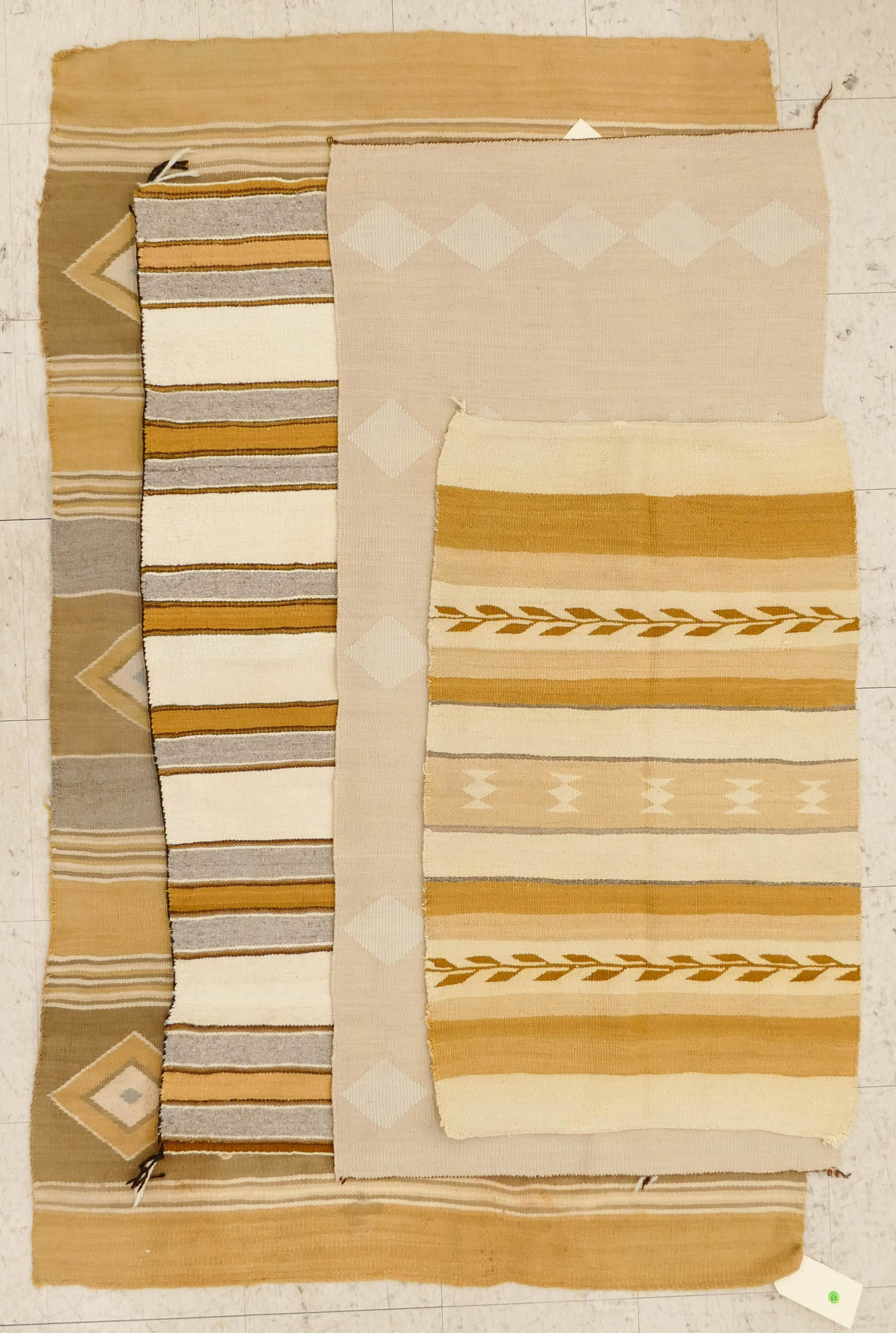 4pc Vintage Navajo Yellow Wool Rugs: 4pc Vintage Navajo Yellow Wool Rugs. Diamond banded pattern rug measure 6'2''x3'11'' (scattered stains and holes), grey banded measures 4'6''x2'5'' (excellent condition), tan diamond pattern measures 