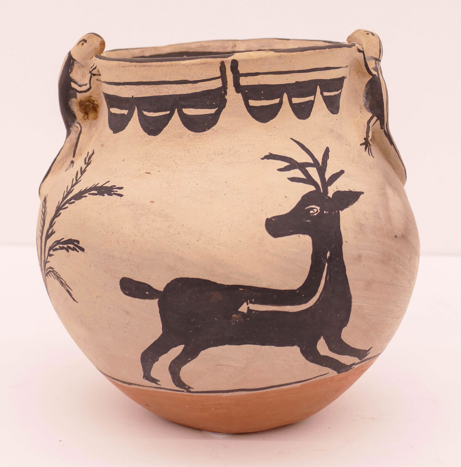 Teresita Romero Cochiti Deer and Lizard Jar: Teresita Romero (b.1894-1991 Cochiti) Deer and Lizard Jar. Measures 7'' tall with 7'' diameter. 3 color jar with figural lizard handles and deer motifs. Signed on base. Excellent condition. Collection