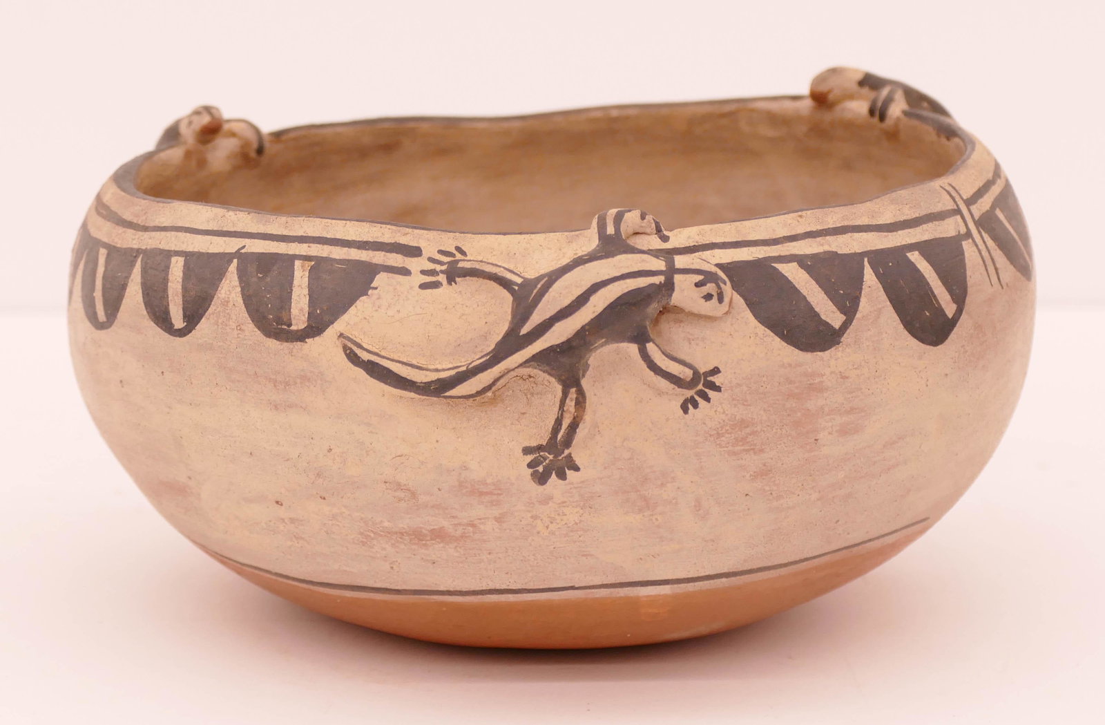 Teresita Romero Cochiti Polychrome Lizard Bowl: Teresita Romero (b.1894-1991 Cochiti) Polychrome Lizard Bowl. Measures 4'' tall with 7.5'' diameter. 3 color bowl with 5 figural lizards applied to rim and interior. Signed on base. Excellent conditio