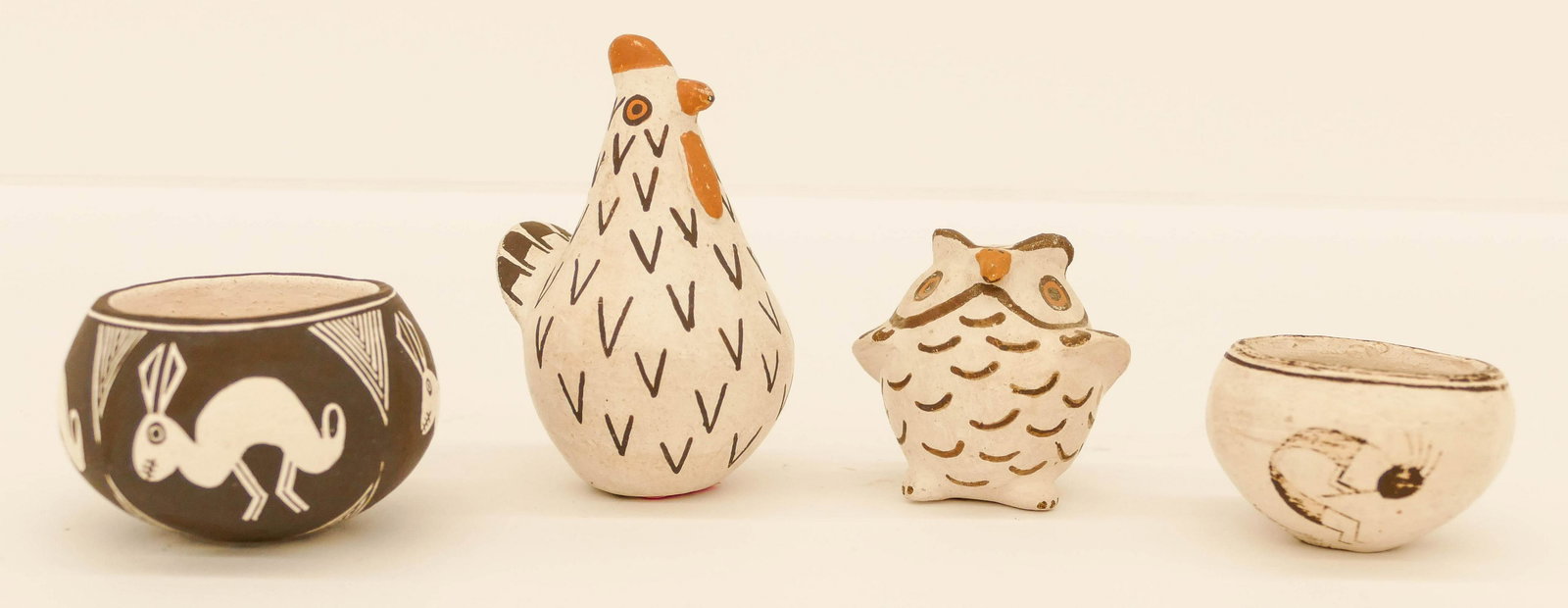 4pc Old Lewis & Chino Acoma Miniatures: 4pc Old Lewis & Chino Acoma Miniatures. Sizes range from 2'' to 2.5''. Includes 2 polychrome chicken and owl figures by Marie Chino, Emma Lewis mimbres style rabbit miniature bowl, and Dolores Lewis A