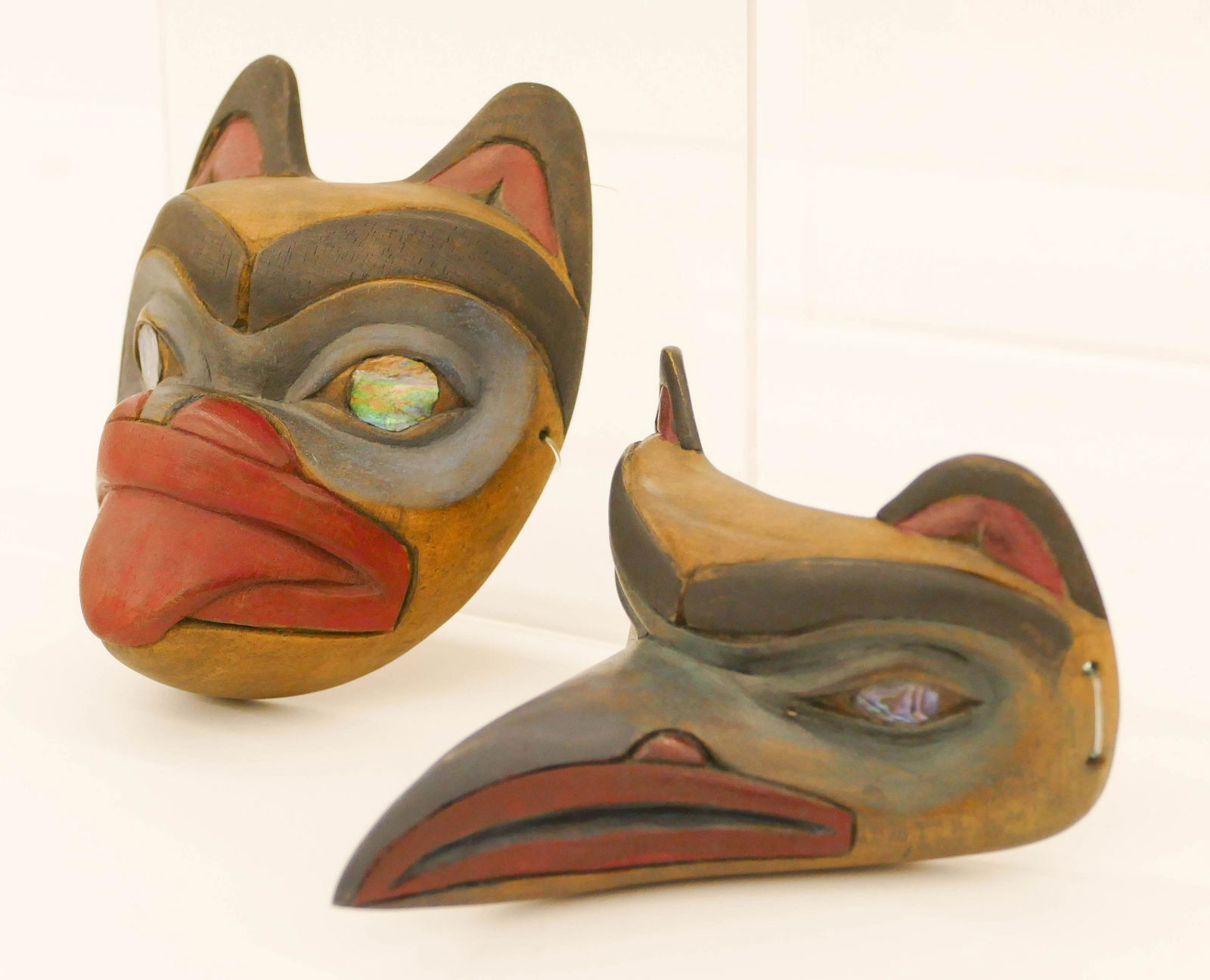 2pc Richard LaValle Miniature Masks: 2pc Richard LaValle (b.1945 Adopted Tlingit) Miniature Masks. Both measure 4'' tall. Includes bear and thunderbird masks with inlaid abalone eyes. Signed on verso. Excellent condition.
