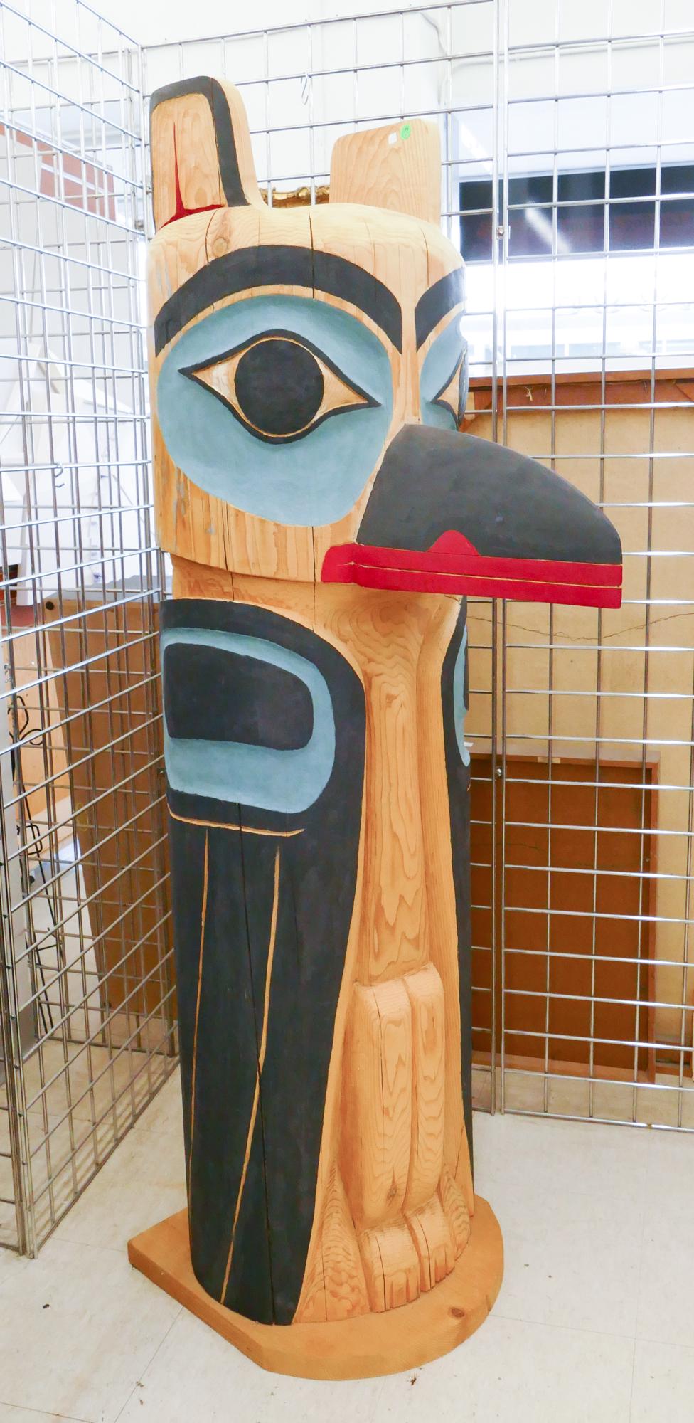 Len Talbott Carved Cedar Raven Large Totem: Len Talbott (20/21st Century Washington) Carved Cedar Raven Large Totem, 2011. Measures 62.5x16x27''. Signed and dated on verso. Some natural cracking to wood.