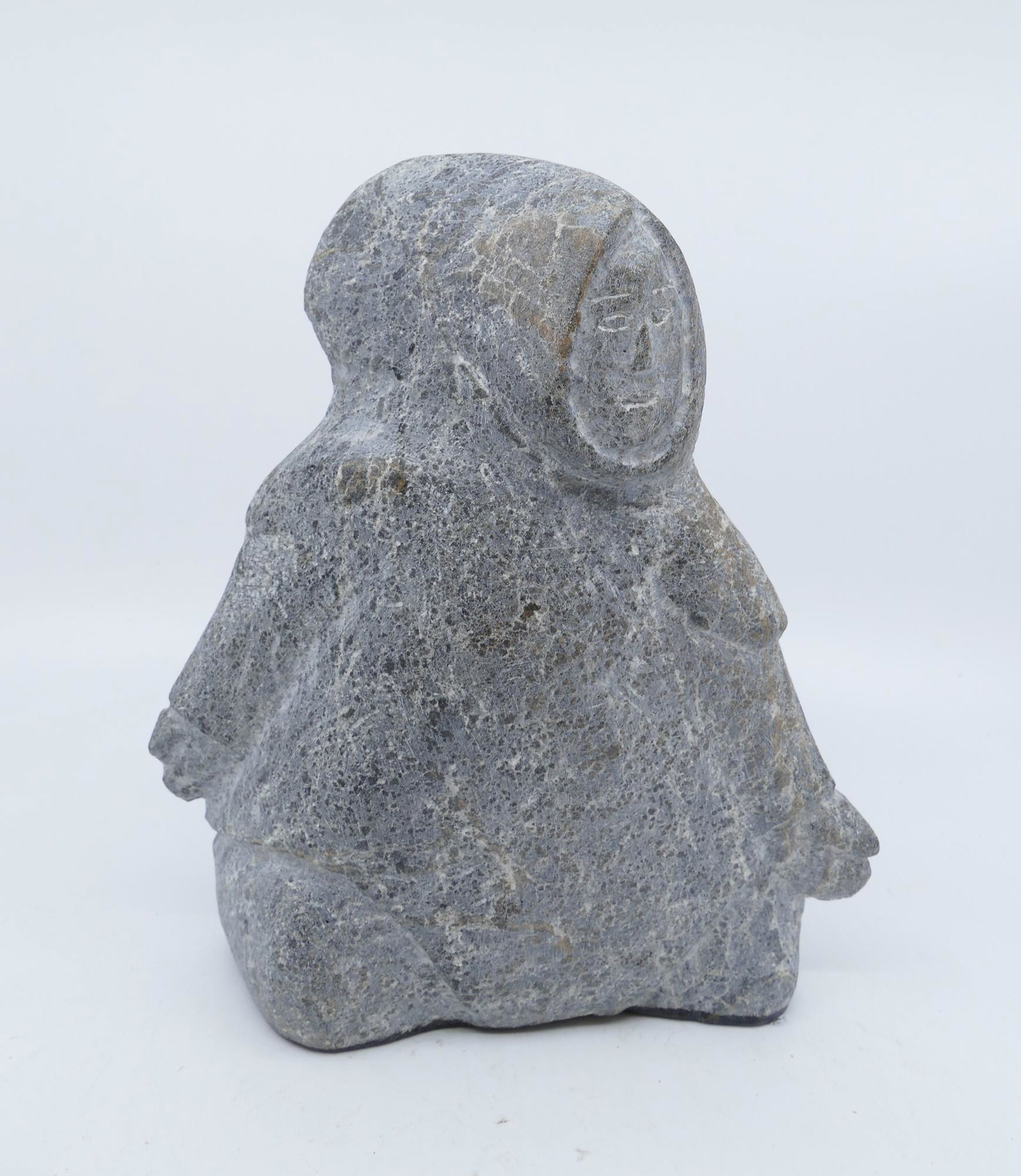 Lucy Tikiq Tunguak ''Eskimo Woman'' Stone Sculpture: Lucy Tikiq Tunguak (b.1939 Inuit) ''Eskimo Woman'' Stone Sculpture, 1995. Measures 7.5''x6''. Signed on base in syllabic. Excellent condition.