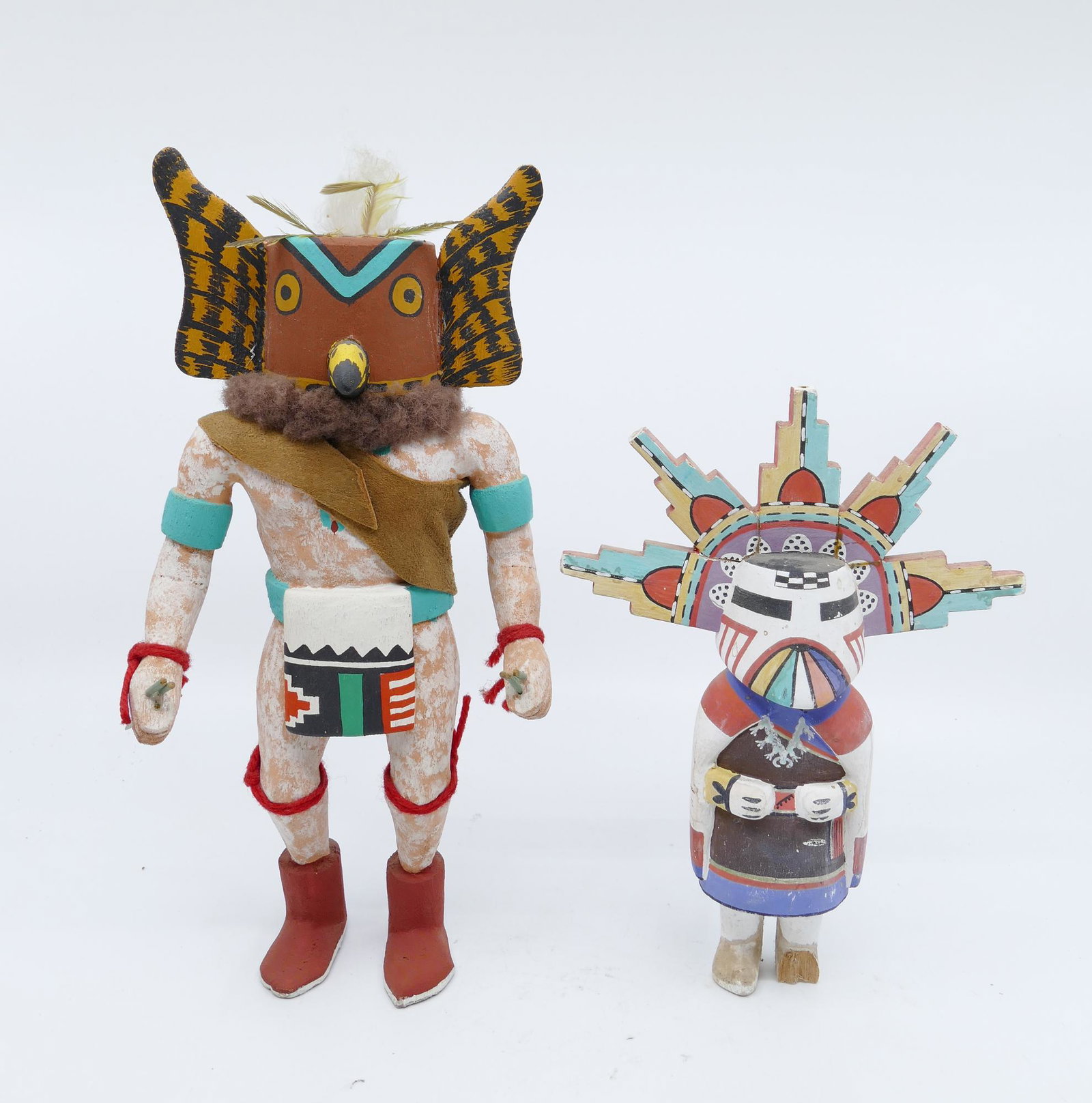 2pc Vintage Hopi Kachina Dolls: 2pc Vintage Hopi Kachina Dolls. Includes Arthur Yowytewa (1922-2006 Hopi) ''Great Horned Owl'' Kachina Doll (10''), and Unsigned Polychrome Sun Kachina (7.5''). Both have old repairs and small missing
