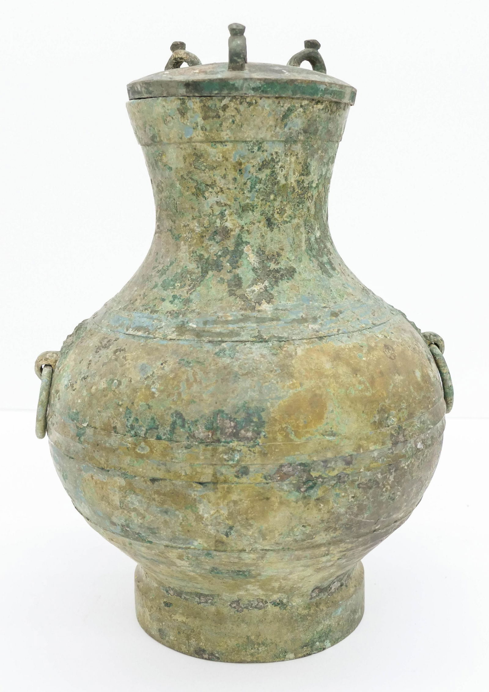 Chinese Han Bronze Covered Hu Wine Vessel: Chinese Han Bronze Covered Hu Wine Vessel 15''x11''. An early archaistic ritual vessel with three loop handles on lid. Also molded taotie mask and ring handles. Vessel has a 3'' crack on side with som