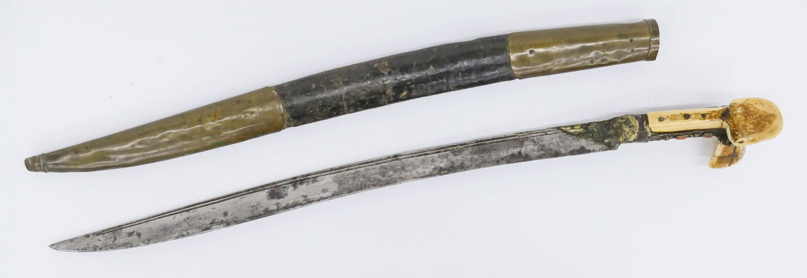 Antique Turkish Islamic Yatagan Sword: Antique Turkish Islamic Yatagan Sword 29''. Copper and bone handle inset with red coral. Brass and leather scabbard. Blade has etched inscription. Scattered wear from use. Ottoman empire, circa 1800 (