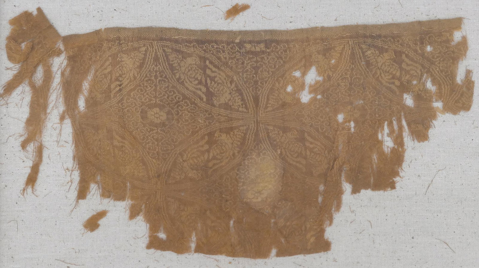 Chinese Ancient Phoenix Textile Fragment: Chinese Ancient Phoenix Textile Fragment 8''x14''. A scarce early silk fragment with phoenix roundels. Shadowbox displayed 18.5''x22.5''. As seen condition. Song to Ming dynasty, 11th to 16th century.
