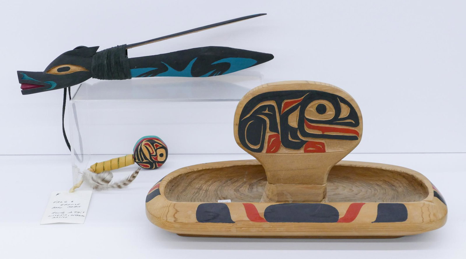 3pc Northwest Coast Artist Signed Cedar Objects: 3pc Northwest Coast Artist Signed Cedar Objects 4.5'' and 14''. Includes a polychrome painted and carved frog bowl by Larry Hnidan, a small frog and grouse baby rattle by Randy Tait, and a Salish sea 
