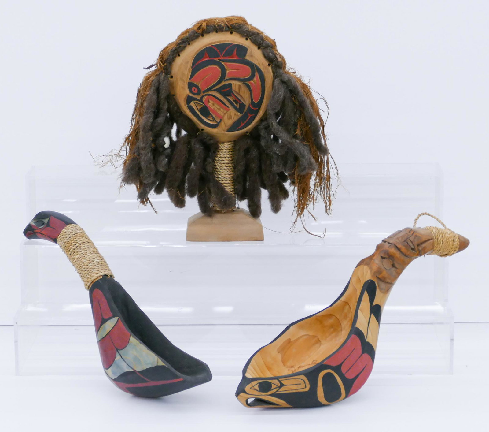 3pc Jacob Joe (Cowichan) Rattle and Ladles: 3pc Jacob Joe (20/21st Cent. Cowichan) Bird Rattle and Ladles 12'' to 15''. Includes a trio of carved and polychrome painted Northwest Coast figural bird rattle and ladles. Signed on bottom. One ladle