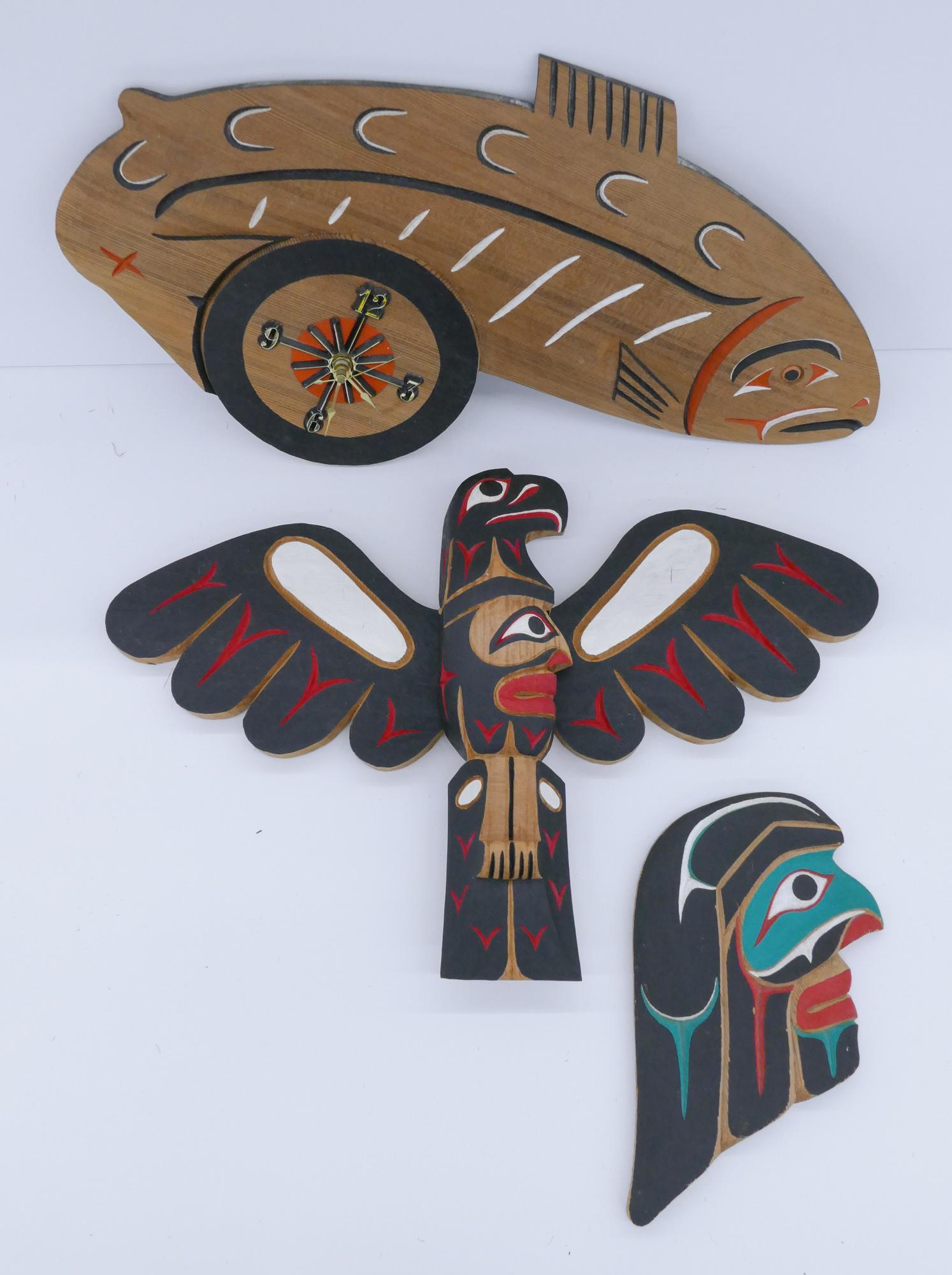 3pc Kimm Brown Makah Wall Carvings Cedar: 3pc Kimm Brown (20/21st Cent. Makah) Wall Plaques and Clock Cedar 9'' to 19''. Carved and polychrome painted u-form thunderbird, portrait, and salmon clock. Signed on verso. Excellent condition.