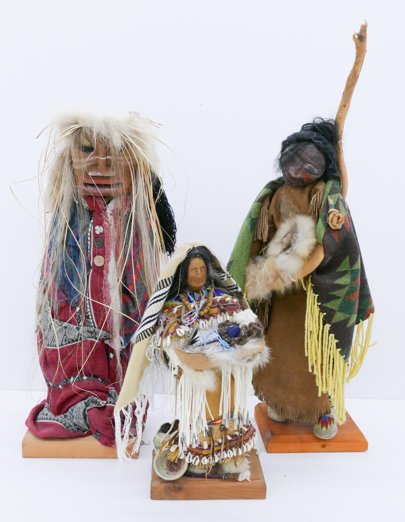 3pc Kim Elkins Native Handmade Dolls: 3pc Kim Elkins (20/21st Cent. Washington) Native Handmade Dolls 18'' to 35''. Includes a Northwest Coast doll with mask, a plains crow mother and child doll, and a plains gatherer doll with baskets. S
