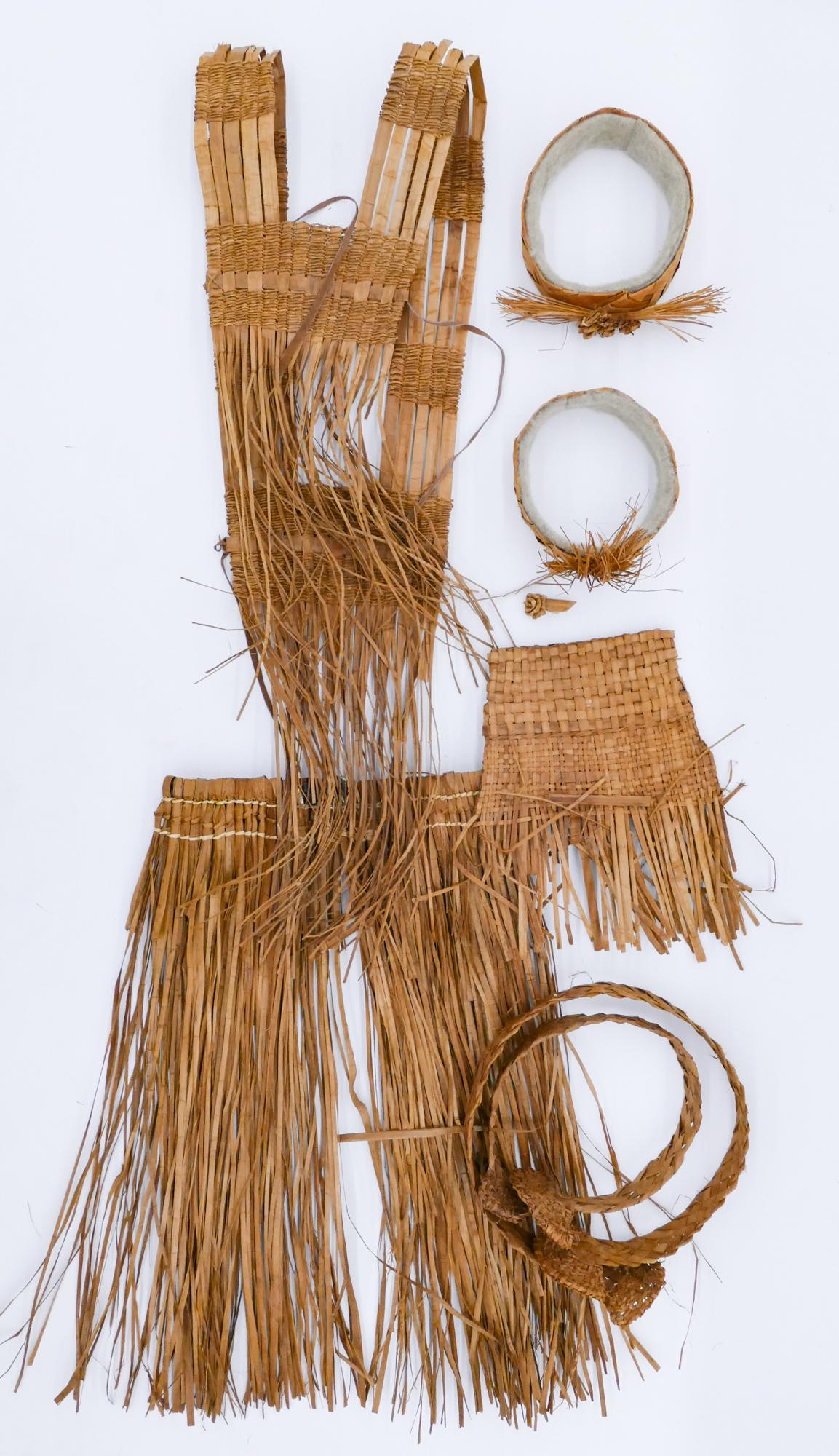 7pc Northwest Coast Cedar Basketry Clothing: 7pc Northwest Coast Cedar Basketry Clothing 8'' to 37'' Long. Makah or Nuu-chah-nulth. Includes a dance vest and skirt, pair of floral headbands, two woven belts, and an unfinished hat or open basket.