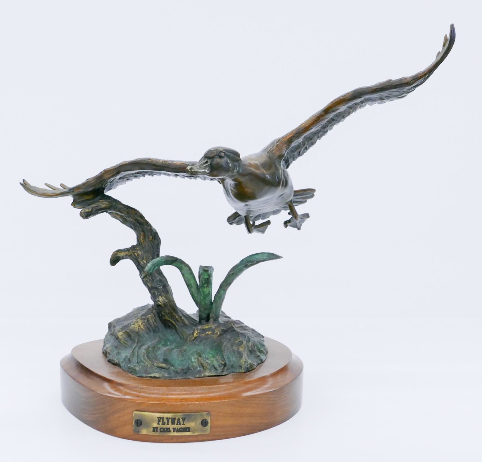 Carl Wagner ''Flyway'' (Duck) 1992 Bronze: Carl Wagner (1938-2011 American) ''Flyway'' (Duck) 1992 Patinated Bronze Sculpture 14''x14''. Signed and numbered 7 of 50 edition on base. Excellent condition. (HM)