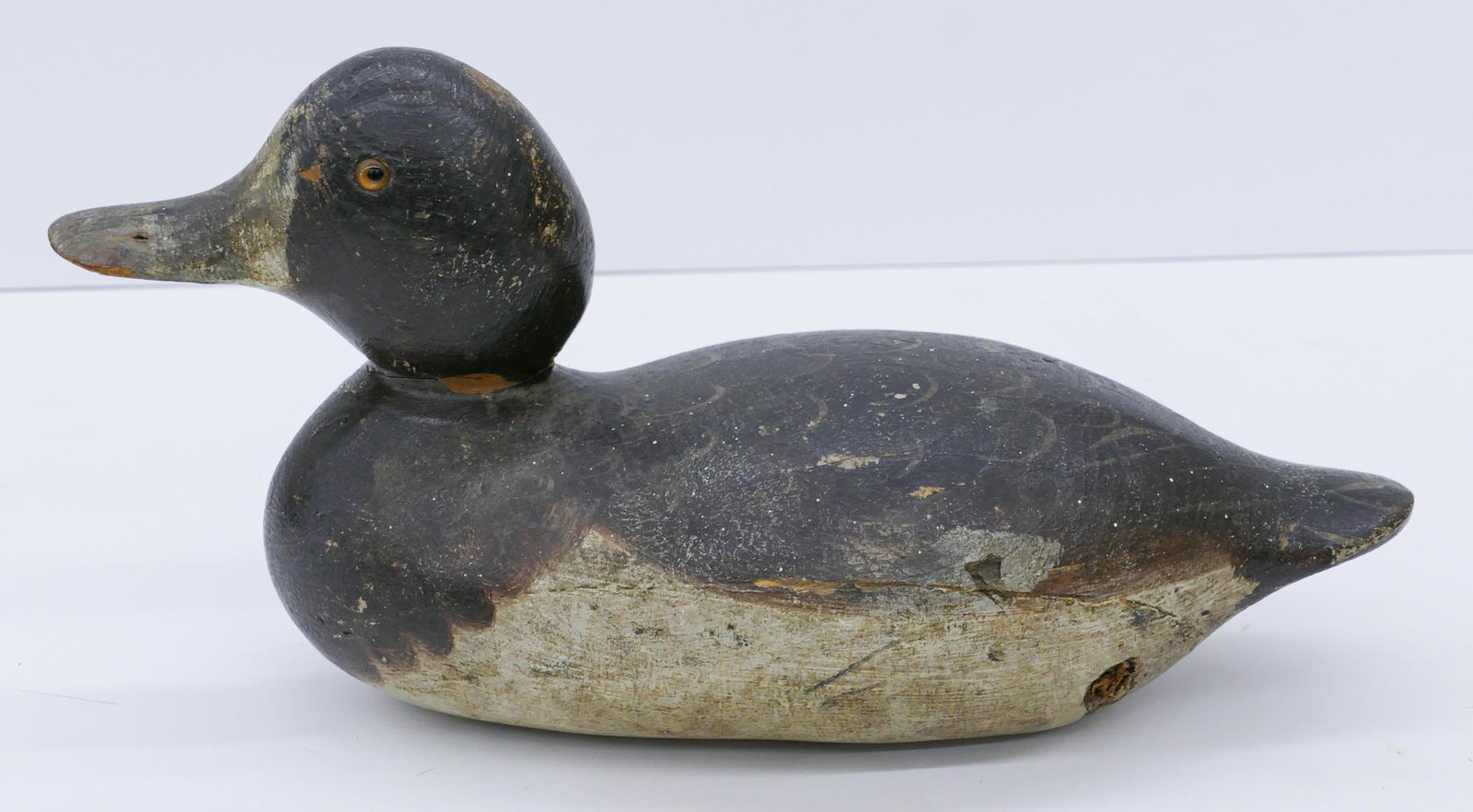 Antique Mason Canvasback Hen Duck Decoy: Antique Mason Canvasback Hen Duck Decoy 13''. Hand painted with inset glass eyes. Labeled ''Circa 1915 Mason Duck Factory Detroit'' on bottom. Scattered surface wear from use.