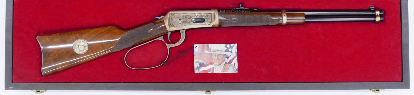 Winchester Model 94 John Wayne .32-40 Cased Rifle: Winchester Model 94 John Wayne .32-40 Cased Rifle 43''x11''. Lever action .32-40 Win. rifle with 18'' barrel. Serial number DUKE 933. Limited edition of 1000. Clean, unfired condition. Lot requires FF