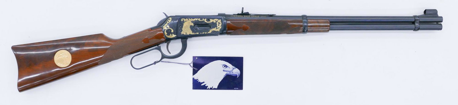Winchester Model 94 XTR Big Bore American Eagle Rifle: Winchester Model 94 XTR Big Bore American Eagle Rifle 38''. Commemorative lever action .375 Win rifle with 20'' barrel. Serial number ABE117. Clean, unfired condition. No box or papers. Lot requires F