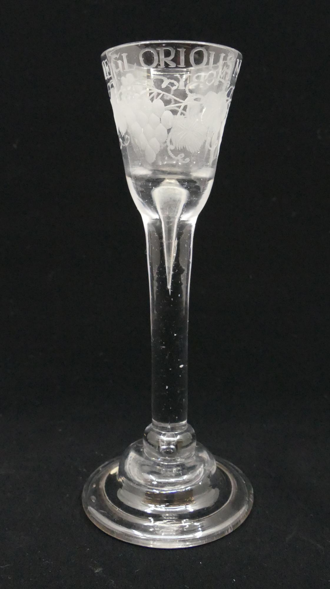 18th Century English Williamite Wine Glass: 18th Century English Williamite Wine Glass. Engraved 'The Glorious Memory' with depictions of grape bunches and vines around bowl. Domed and folded base. Open air bubble below bowl into stem. Measures