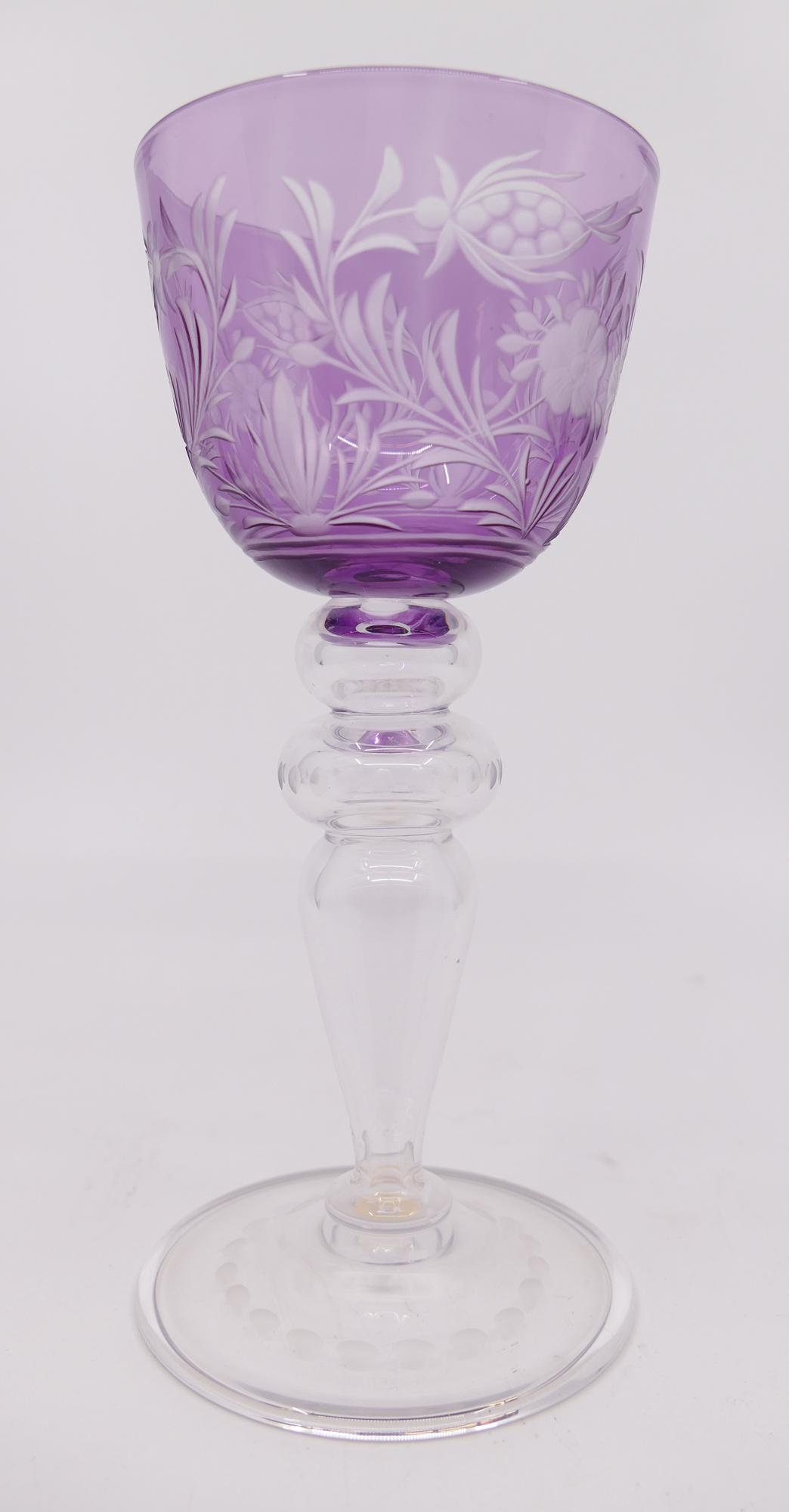 Steuben Purple Baluster Stem Wine Goblet: Steuben Purple Baluster Stem Wine Goblet. Etched floral design on bowl, hollow baluster stem. Marked on foot. Measures 6.75'' tall with 3'' rim. Excellent condition with no chips or cracks.