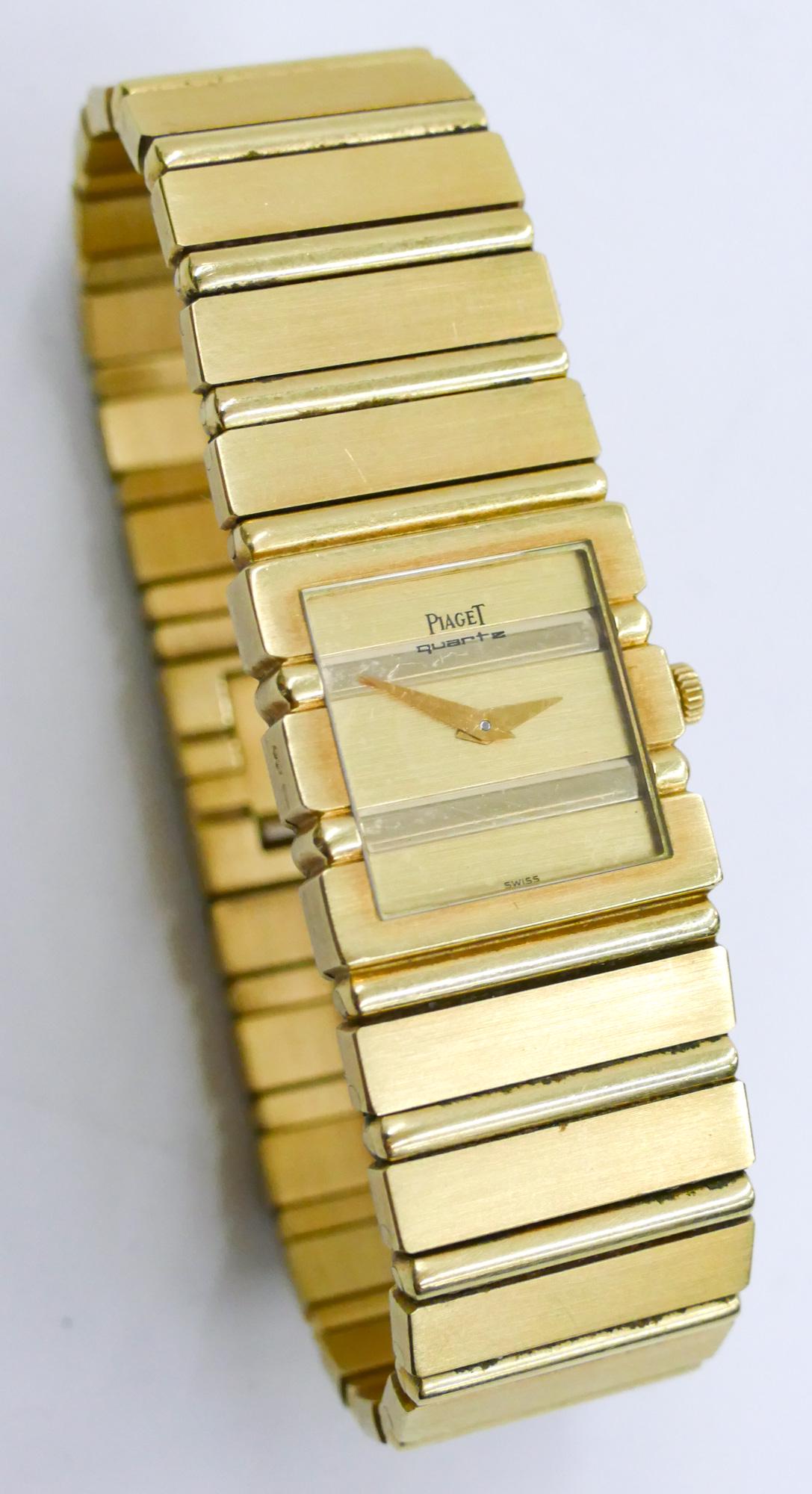 Men's Piaget 18k Solid Band Polo Tank Wristwatch: Men's Piaget 18k Solid Band Polo Tank Wristwatch 7''. Model 8131 C701 and Serial No. 394484. Swiss quartz movement, non running. 20mm bezel. Comes in original Piaget leather box with extra link. It we