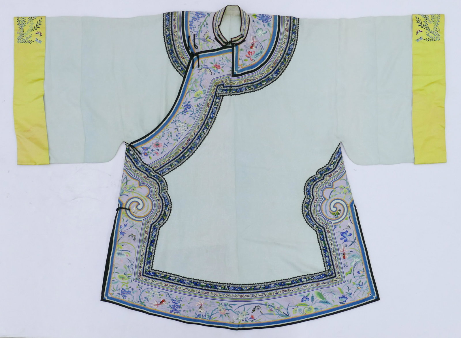Chinese Silk Embroidered Mandarin Robe: Chinese Silk Embroidered Mandarin Robe 42''x56''. Polychrome embroidered robe with silk brocade. Sleeve panels and edges with flower, insect, and goldfish motifs. Overall excellent condition. Early to