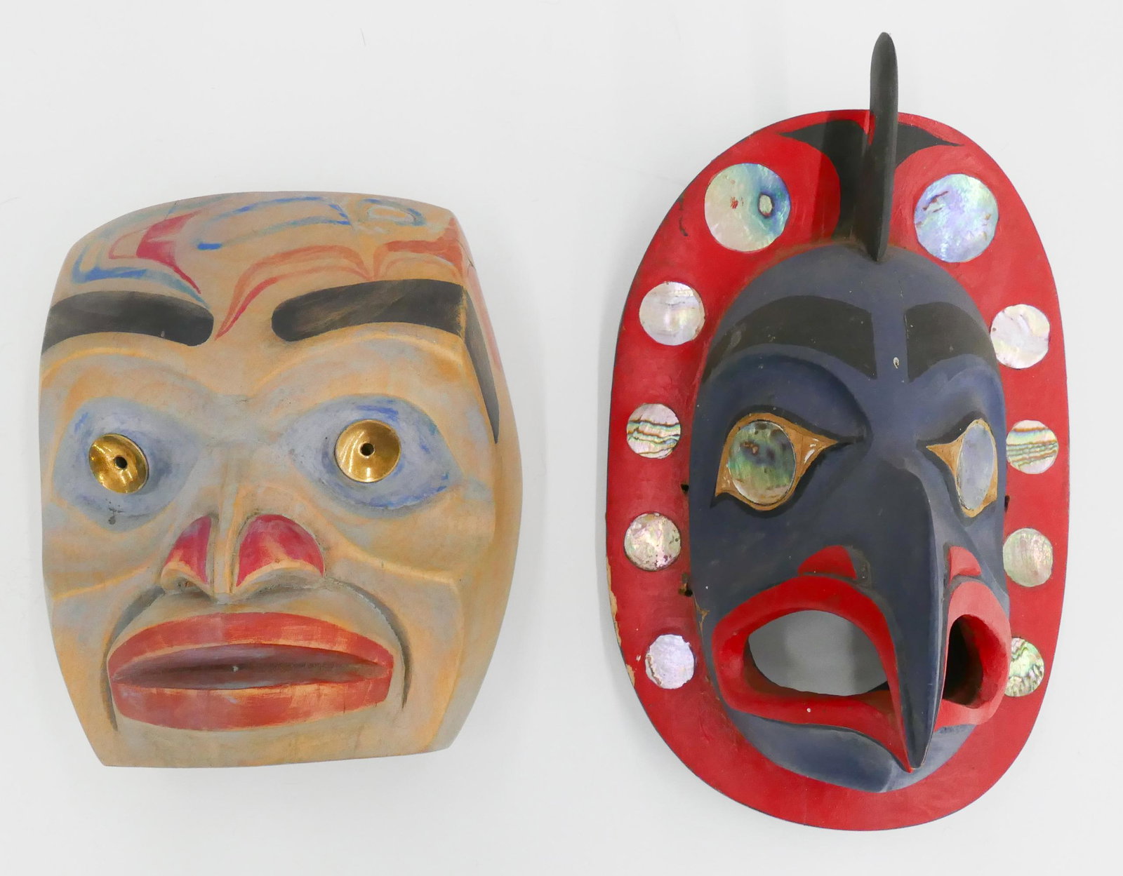 2pc Charles Smith Frontlet Masks Cedar: 2pc Charles Smith (1922-2009 Washington) Frontlet Masks Cedar 7'' and 9.5''. Includes a carved and polychrome painted u-form killer whale eagle frontlet with inlaid abalone. Also a small portrait mask