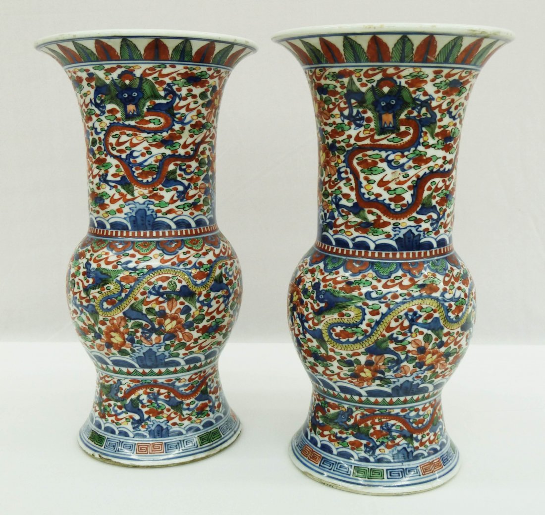 Pair of Chinese Wucai Gu Beaker Vases with Dragons: Pair of Chinese Matching Wucai Gu Beaker Vases with 4-Claw Dragons Chasing Flaming Pearl & Flower Motifs 11.5'' - Ming Wanli Mark on Bottom in Blue Underglaze - Drilled Bases