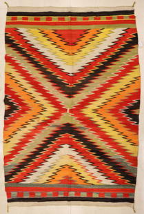 Old Navajo Germantown Eye Dazzler Rug: Old Navajo Germantown Eye Dazzler Rug 5'2''x7'6''. Polychrome eye dazzler motif in an array of colors including greens. Some scattered wear from age. Early to mid 20th century.