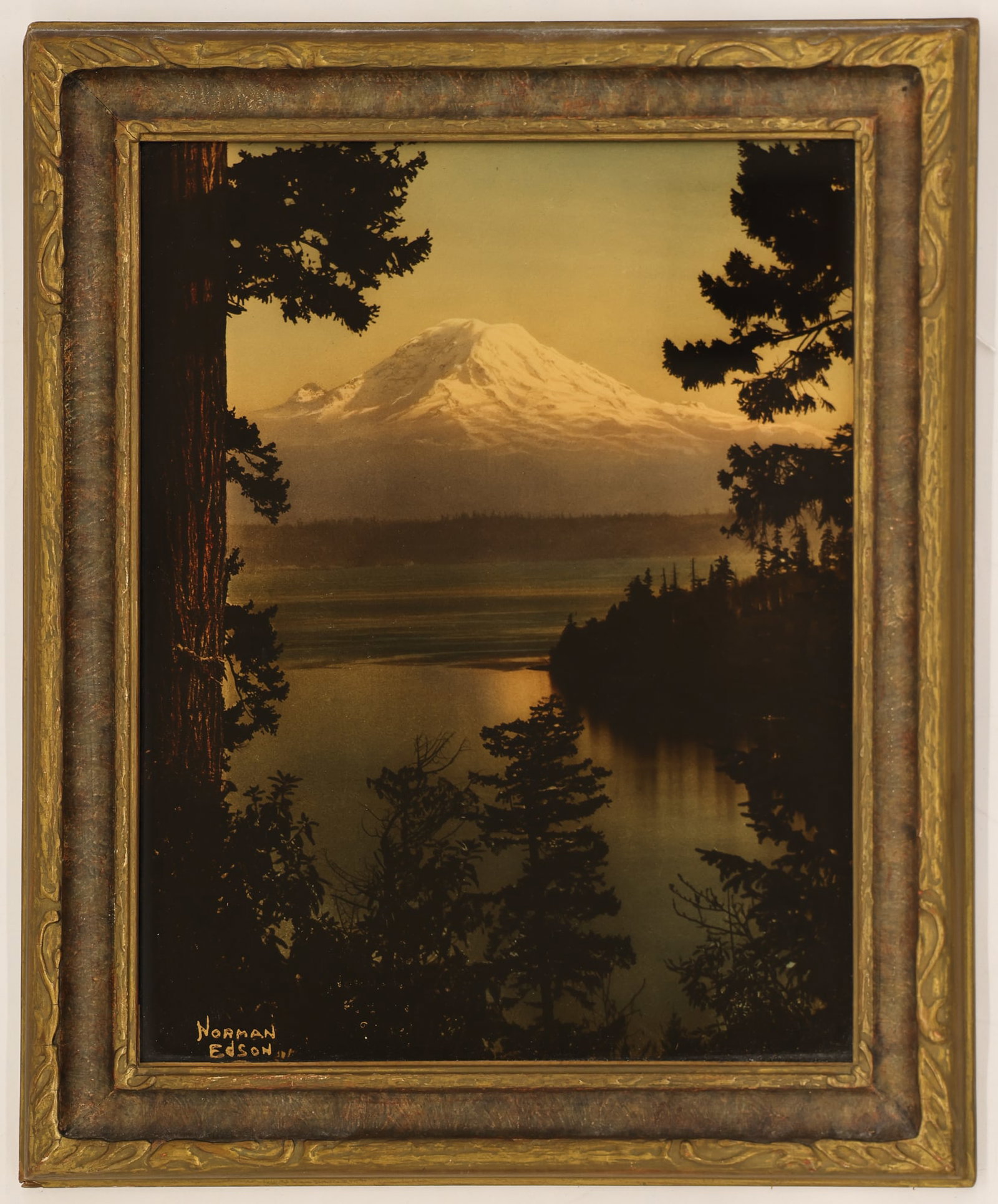 Norman Edson ''The Sun's Last Glow'' Orotone: Norman Edson (1879-1968 Washington) ''The Sun's Last Glow'' Tinted Orotone Photograph 14''x11'' Image. Signed in gold lower left corner. Original period framing with backing intact 17''x14''. Excellen