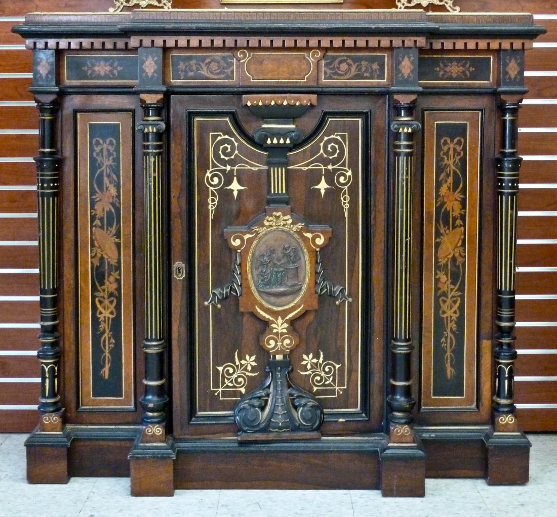 Herter Style American Aesthetic Movement Parlor Cab: Herter Style American Aesthetic Movement Parlor Cabinet. Gilt with Marquetry Inlay. Ebonized Wood with Bronze Oval Plaque in center panel. 44''x49''x15''