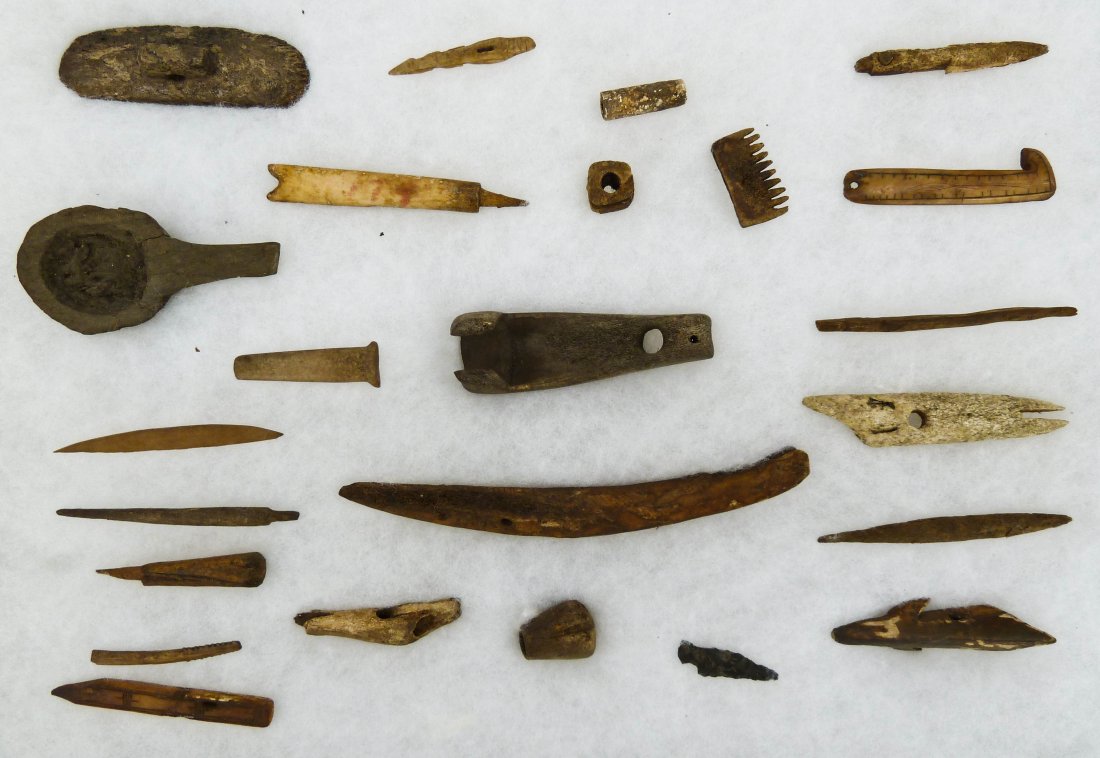 Collection of (35) Eskimo Indian Implements & Artif: Collection of (35) Eskimo Indian Implements & Artifacts. Sizes range 1'' to 6''. Includes gaming pieces, arrowheads, combs, spear tips, etc. Collected in Fairbanks, Alaska.